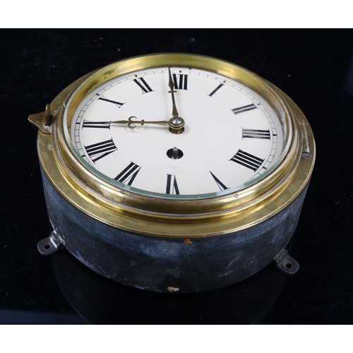 79Q - A 19th century brass-fronted circular dial bulkhead 30-hour wall clock, cream enamel dial with Roman... 