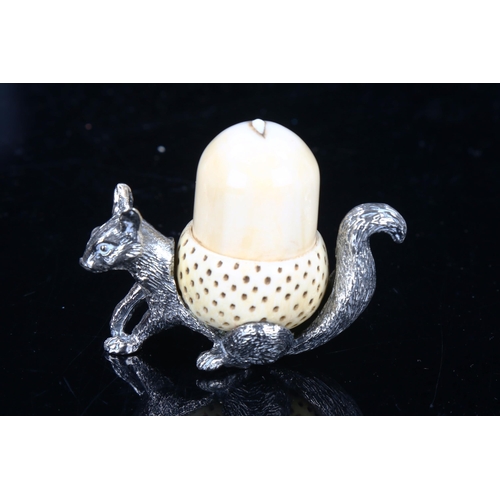 1303 - An early 20th century Mappin & Webb silver plated squirrel and ivory acorn pin cushion and thimble h... 