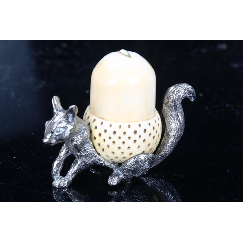 1303 - An early 20th century Mappin & Webb silver plated squirrel and ivory acorn pin cushion and thimble h... 