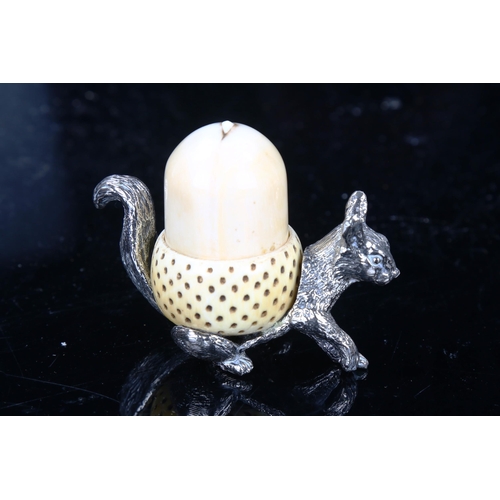 1303 - An early 20th century Mappin & Webb silver plated squirrel and ivory acorn pin cushion and thimble h... 