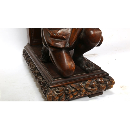 1238 - An impressive 19th century walnut hall/serving table, the top having a leaf carved edge with 2 carve... 