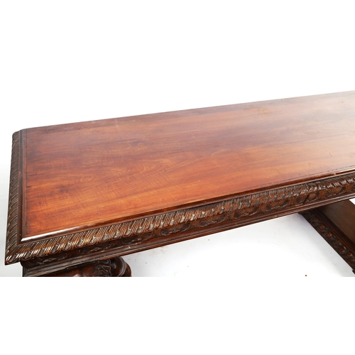 1238 - An impressive 19th century walnut hall/serving table, the top having a leaf carved edge with 2 carve... 