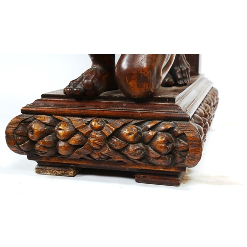 1238 - An impressive 19th century walnut hall/serving table, the top having a leaf carved edge with 2 carve... 