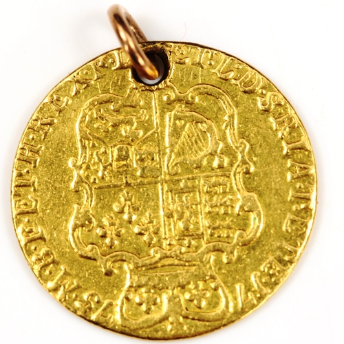 118 - A George III 1775 gold guinea coin, fourth portrait with rose shield and pierced pendant loop, 8.3g