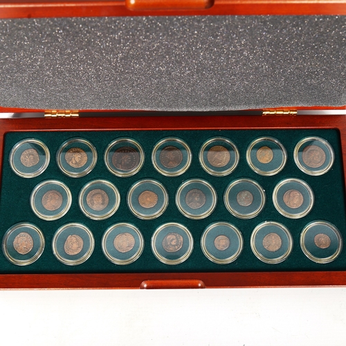 1534 - A collection of Roman bronze coins depicting 20 Emperors, 3rd and 4th century AD, in display case