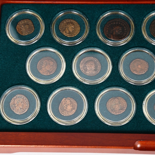 1534 - A collection of Roman bronze coins depicting 20 Emperors, 3rd and 4th century AD, in display case