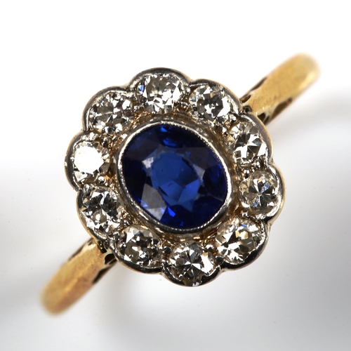 186 - A sapphire and diamond oval cluster ring, unmarked gold settings with oval mixed-cut sapphire and ol... 