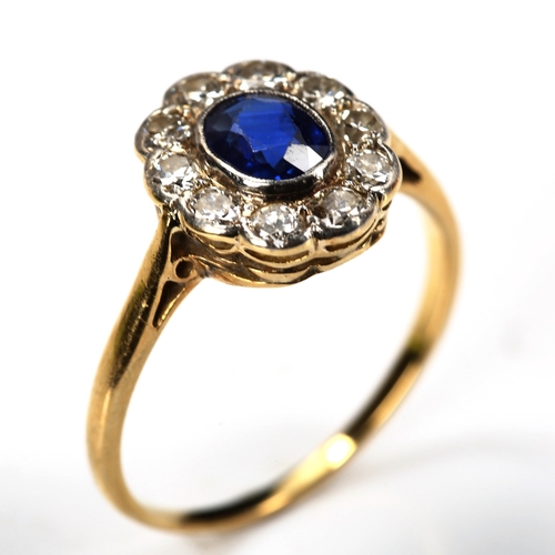 186 - A sapphire and diamond oval cluster ring, unmarked gold settings with oval mixed-cut sapphire and ol... 