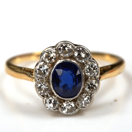 186 - A sapphire and diamond oval cluster ring, unmarked gold settings with oval mixed-cut sapphire and ol... 