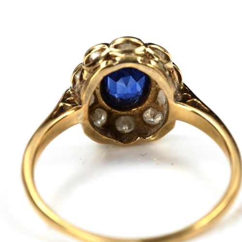 186 - A sapphire and diamond oval cluster ring, unmarked gold settings with oval mixed-cut sapphire and ol... 