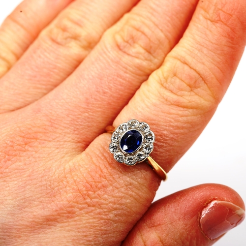 186 - A sapphire and diamond oval cluster ring, unmarked gold settings with oval mixed-cut sapphire and ol... 