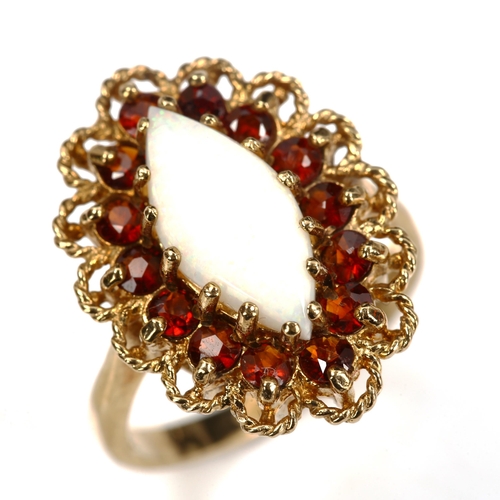 190 - A late 20th century 9ct gold opal and garnet marquise cluster ring, set with marquise cabochon white... 