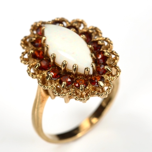 190 - A late 20th century 9ct gold opal and garnet marquise cluster ring, set with marquise cabochon white... 