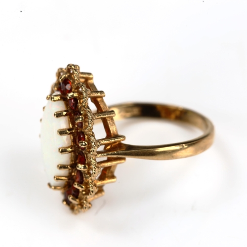 190 - A late 20th century 9ct gold opal and garnet marquise cluster ring, set with marquise cabochon white... 