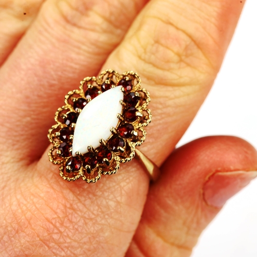 190 - A late 20th century 9ct gold opal and garnet marquise cluster ring, set with marquise cabochon white... 