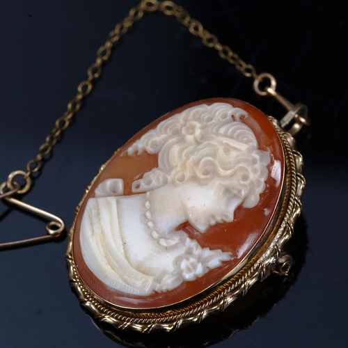 195 - A relief carved shell cameo brooch, in 9ct gold frame, brooch height 33.2mm, 6.3g