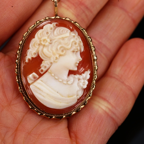 195 - A relief carved shell cameo brooch, in 9ct gold frame, brooch height 33.2mm, 6.3g