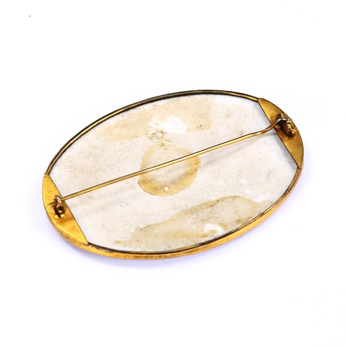 199 - A large Victorian oval watercolour on porcelain brooch, depicting female portrait, in unmarked yello... 