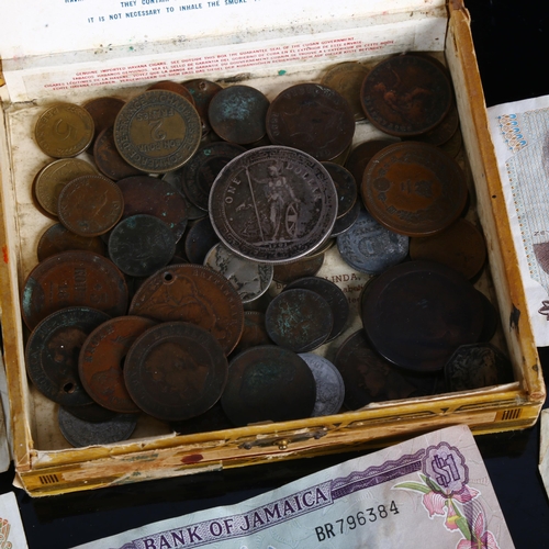 1449 - Various world coins and banknotes, including 1901 silver British Britannia One Dollar Trade token, e... 