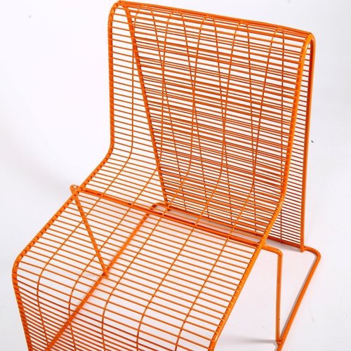 SHIN and TOMOKO AZUMI, an orange, plastic coated, wire frame chair 