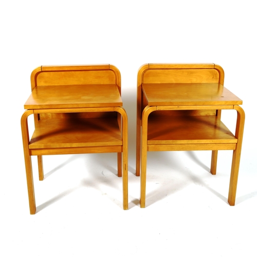 1891 - A pair of Aalto style, Finish, ISKU OY bent ply birch bedside tables or nightstands with maker’s lab... 