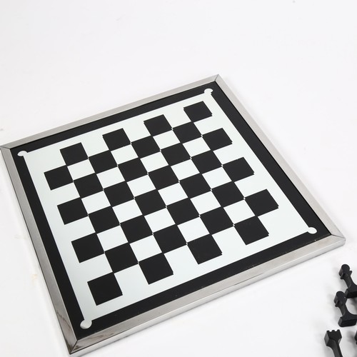 1854 - A 1960s' modernist chess set by ALCAN, France, aluminium pieces with aluminium framed mirror board, ... 