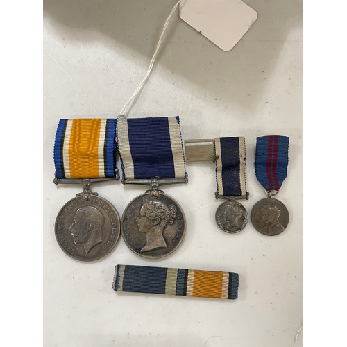 1407 - A pair of Royal Navy Service medals, comprising Victoria Long Service and Good Conduct medal, and a ... 