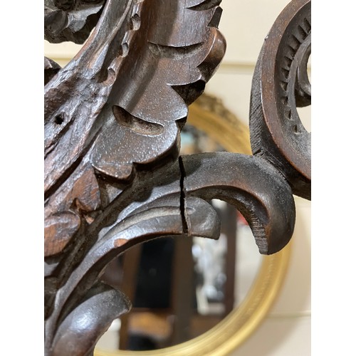 1413 - A 19th century mahogany display easel, with carved acanthus leaf decoration, height 2m