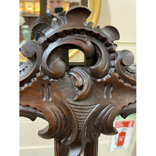 1413 - A 19th century mahogany display easel, with carved acanthus leaf decoration, height 2m