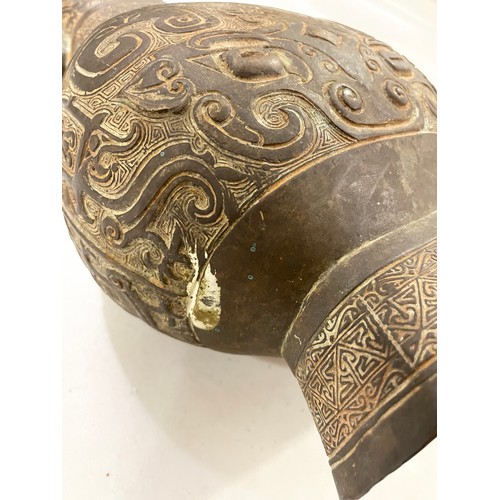 1006 - A Chinese Archaic style bronze vase, with relief decoration and dragon handles, height 30cm