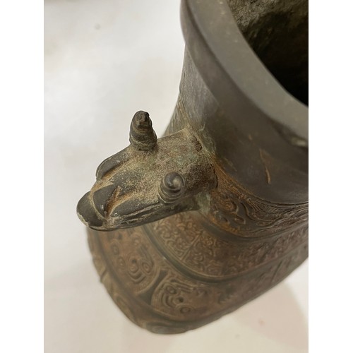 1006 - A Chinese Archaic style bronze vase, with relief decoration and dragon handles, height 30cm