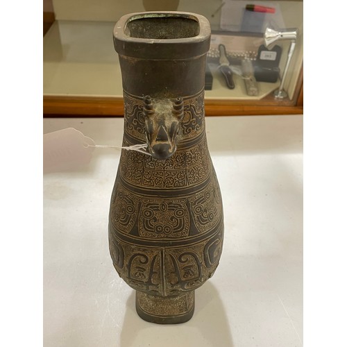 1006 - A Chinese Archaic style bronze vase, with relief decoration and dragon handles, height 30cm