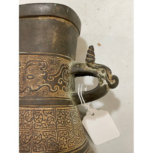 1006 - A Chinese Archaic style bronze vase, with relief decoration and dragon handles, height 30cm