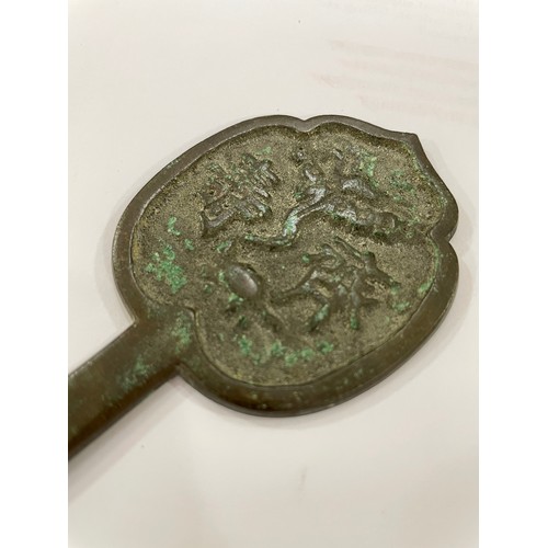 1100 - ANTIQUITIES - a group of miniature Chinese bronze mirrors etc