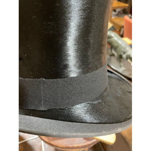 1264 - MANDER & ALLENDERS - a Vintage black silk top hat, in a Victorian brown leather hatbox