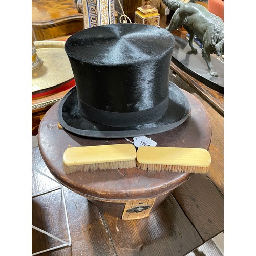 1264 - MANDER & ALLENDERS - a Vintage black silk top hat, in a Victorian brown leather hatbox