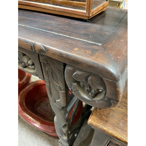 1151 - A Chinese 19th century rosewood altar table, with grapevine carved and pierced frieze on carved supp... 