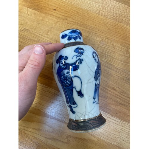 1291 - A pair of Chinese blue and white crackle glaze vases, height 16.5cm