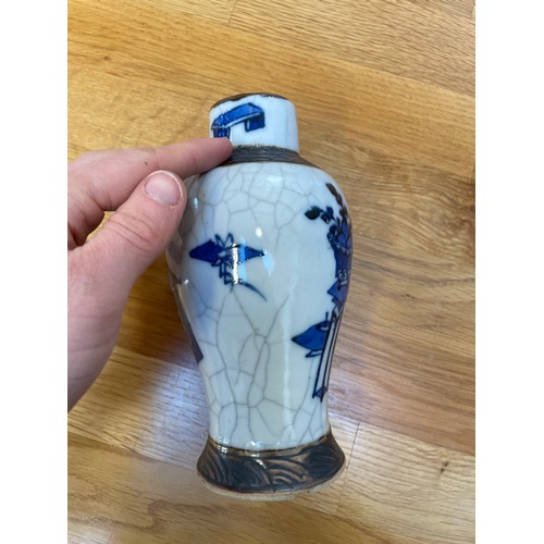 1291 - A pair of Chinese blue and white crackle glaze vases, height 16.5cm