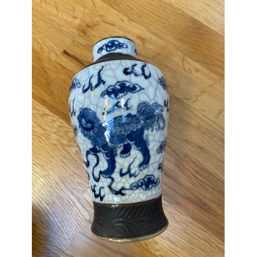 1291 - A pair of Chinese blue and white crackle glaze vases, height 16.5cm