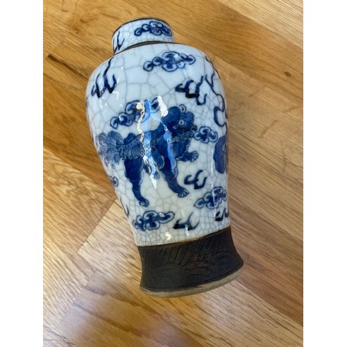 1291 - A pair of Chinese blue and white crackle glaze vases, height 16.5cm