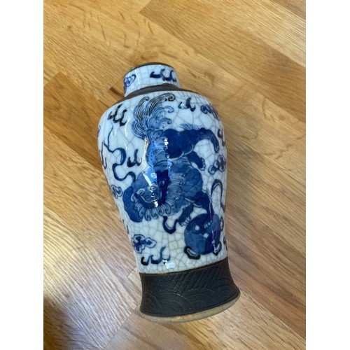 1291 - A pair of Chinese blue and white crackle glaze vases, height 16.5cm