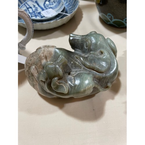 1313 - A large Chinese carved jade cabbage, length 27cm, and a carved stone dog with puppy, length 14cm (2)