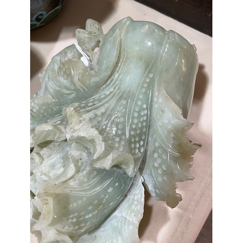 1313 - A large Chinese carved jade cabbage, length 27cm, and a carved stone dog with puppy, length 14cm (2)