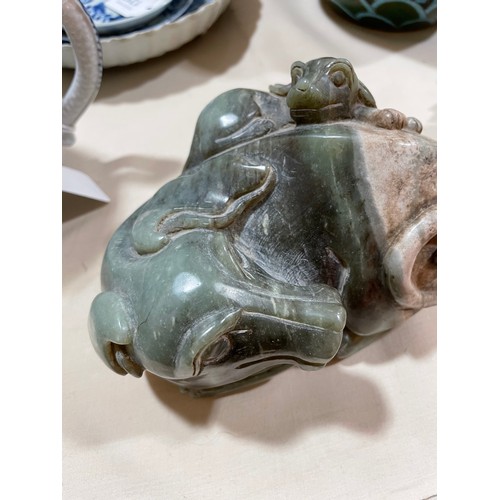 1313 - A large Chinese carved jade cabbage, length 27cm, and a carved stone dog with puppy, length 14cm (2)