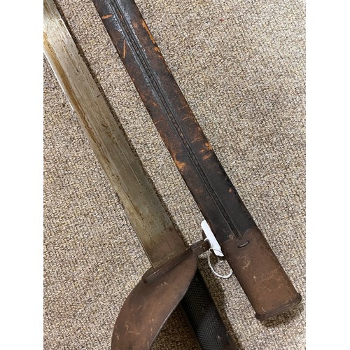 1186 - A 19th century long French sword bayonet, with bowl hilt, maker's marks A and EH, original leather a... 