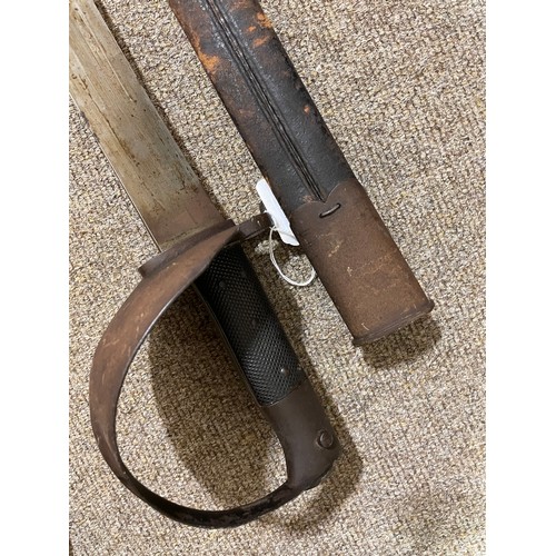 1186 - A 19th century long French sword bayonet, with bowl hilt, maker's marks A and EH, original leather a... 