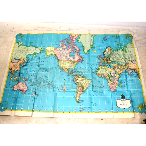 106 - A large scale schoolroom world map, Ardath football team cigarette photocards, and Vintage postcards