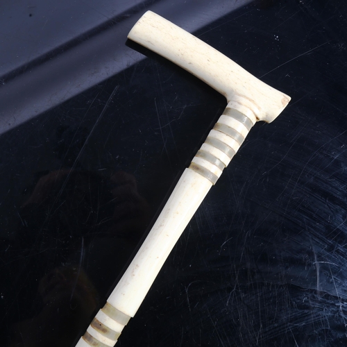 121 - A Vintage bone and horn sectional walking stick, length 92cm