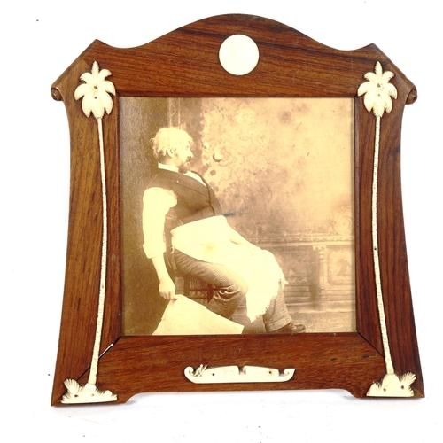 157 - A rosewood and ivory strut photo frame, height 20cm